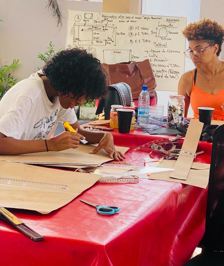 diane teaching children about leatherwork
